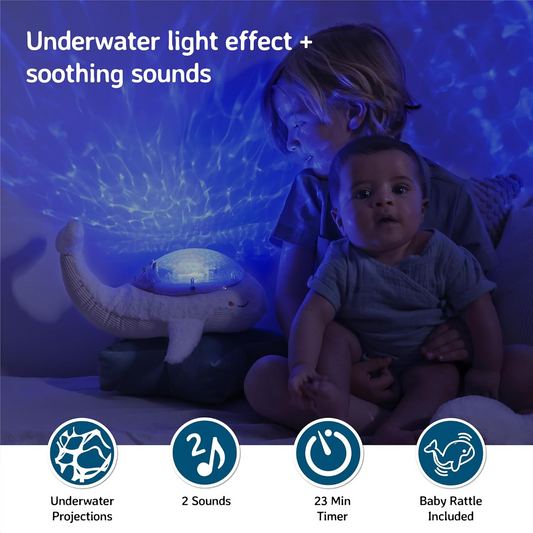 Cloud b Tranquil Whale White - Confortável projetor de luz de baleia com sons suaves | Luz de presença infantil, máquina de ruído branco, bebé | Ajustável, desligar automático em 23 min, inclui chocalho para bebé | LEDs de longa duração