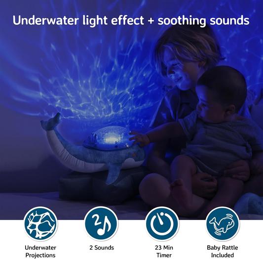 Cloud b Blue Tranquil Whale - Máquina de ruído branco para bebés e luz noturna para crianças - Projetor de luz suave para oceano com sons relaxantes | Definições ajustáveis, desligamento automático | Inclui chocalho baleia bebé