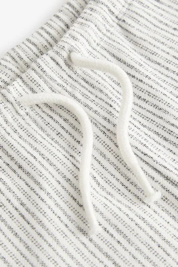 |Boy| Shorts Jersey Listrado Preto/Branco (3 Meses A 7 Anos)