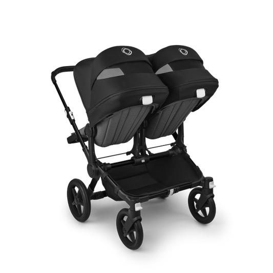 Bugaboo Carrinho Donkey 5 Twin – Capota Midnight Black, tecidos Grey Melange e estrutura preta, design lado a lado.