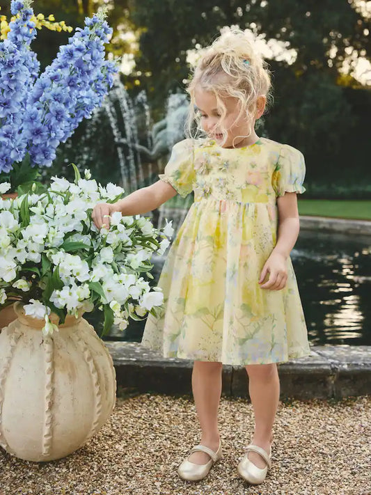 |Girl| Vestido Amarelo com Estampa Floral e Corsage de Flor (3 meses a 8 anos)