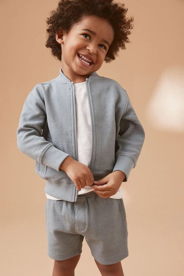 |Boy| Conjunto de jaqueta bomber e shorts com zíper em jersey - Azul Teal (3 meses a 7 anos)
