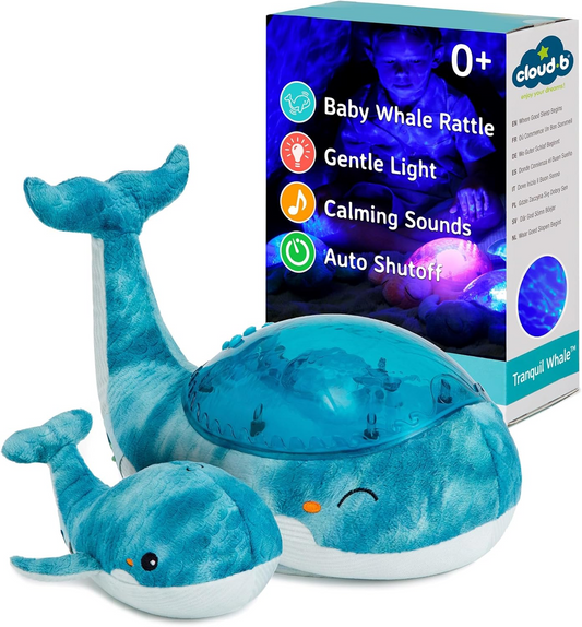Cloud b Blue Tranquil Whale - Máquina de ruído branco para bebés e luz noturna para crianças - Projetor de luz suave para oceano com sons relaxantes | Definições ajustáveis, desligamento automático | Inclui chocalho baleia bebé