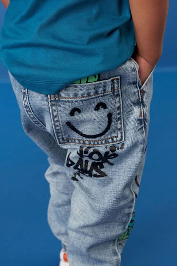 |Boy| Jeans Azul Claro Com Estampa Graffiti (3 meses a 7 anos)