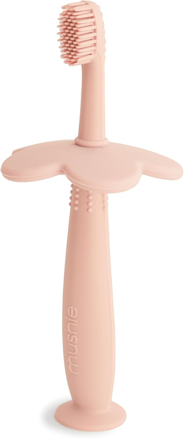 Mushie Escova de dentes de treinamento em silicone, para bebês e crianças pequenas, com base de sucção para fácil armazenamento e treinamento, material: silicone de qualidade alimentar, design de flor