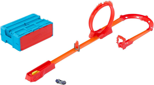 Juego de pistas Hot Wheels, juego de pistas con temática de fuego y 1 auto Hot Wheels, 16 componentes de construcción de pistas y acrobacias en caja de almacenamiento de juguetes apilable, HMC04