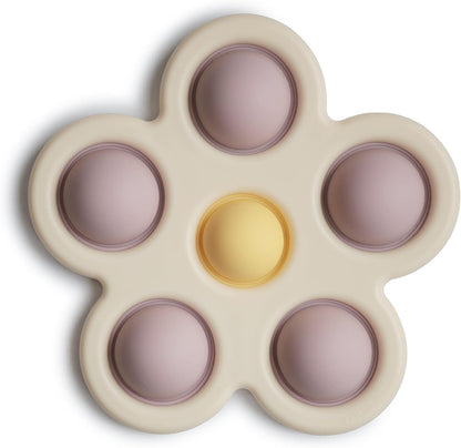 Mushie Brinquedo de apertar | Brinquedo sensorial antiestresse com bolhas | A partir de 10 meses | Brinquedo para aliviar o estresse | 100% silicone de qualidade alimentar e plástico ABS | Design de flor (lilás suave/narciso claro/marfim)