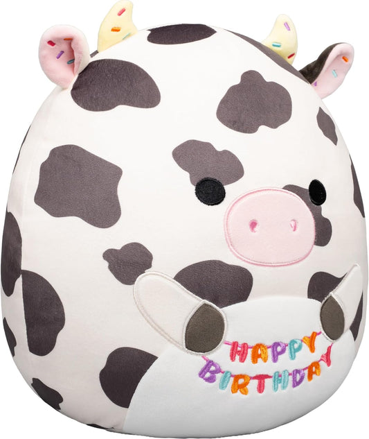 Squishmallows Original de 12 Polegadas – Colin, a Vaca Malhada, Segurando Placa de Aniversário – Pelúcia Oficial Jazwares (Tamanho Médio)