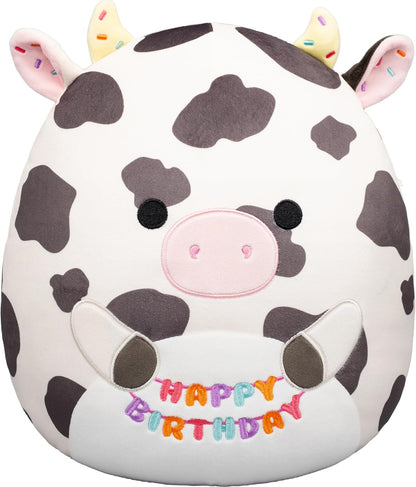 Squishmallows Original de 12 Polegadas – Colin, a Vaca Malhada, Segurando Placa de Aniversário – Pelúcia Oficial Jazwares (Tamanho Médio)