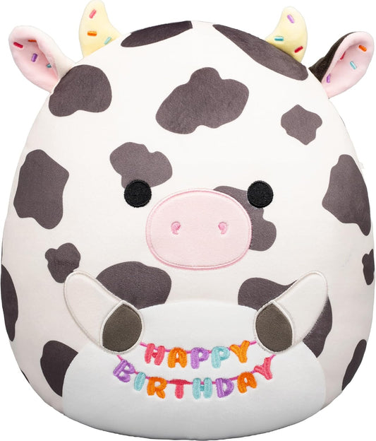 Squishmallows Original de 12 Polegadas – Colin, a Vaca Malhada, Segurando Placa de Aniversário – Pelúcia Oficial Jazwares (Tamanho Médio)