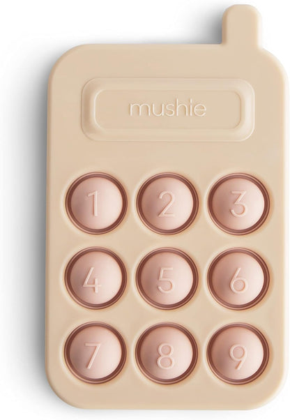 Mushie Brinquedo de apertar | Brinquedo sensorial antiestresse com bolhas | A partir de 10 meses | Brinquedo para aliviar o estresse | 100% silicone de qualidade alimentar e plástico ABS | Design de telefone (rosa)