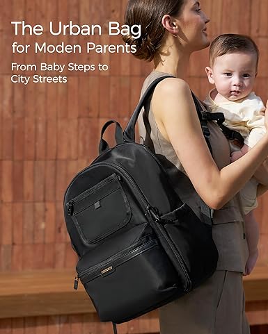 Momcozy Mochila para fraldas Urban - Bolsa para bebês elegante, durável e impermeável com vários bolsos, compartimento para laptop, trocador e alças para carrinho de bebê. Essencial para viagens, pais, trabalho e maternidade.