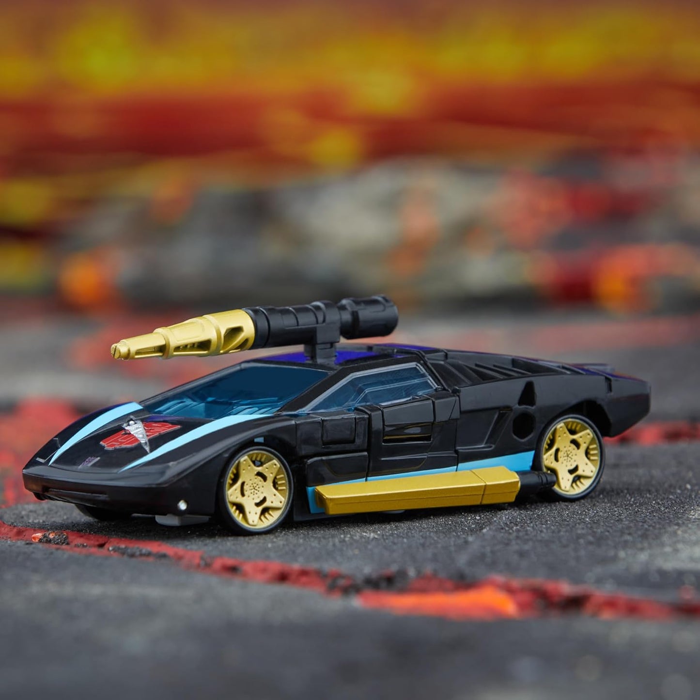 Figura de ação Wheeljack da classe Deluxe de Transformers Legacy do universo Armada