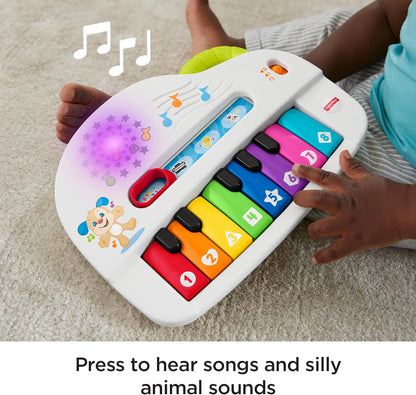 Piano de brinquedo Fisher-Price Silly Sounds com luzes - Edição em inglês do Reino Unido, piano portátil com luzes, notas musicais reais e músicas educativas para bebês e crianças pequenas, GFK04