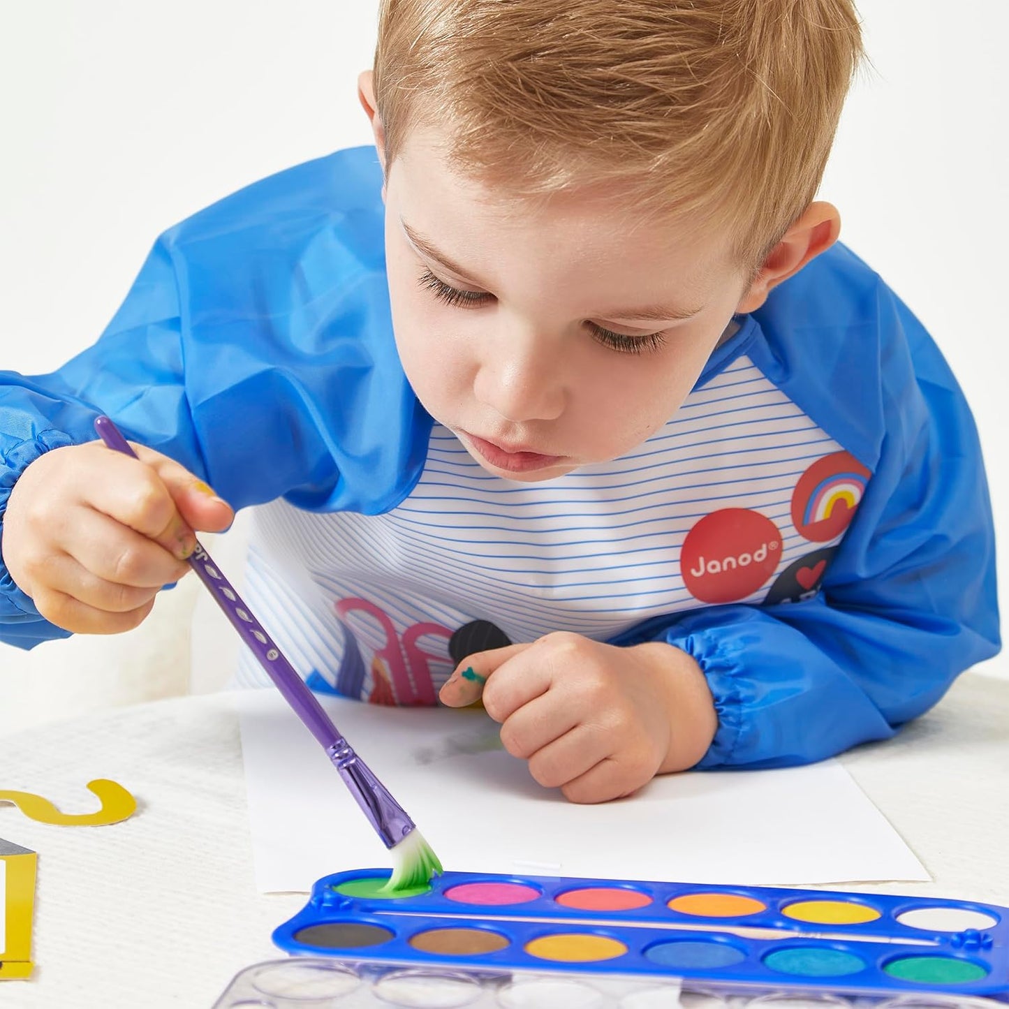 Janod - Pincéis - 4 tamanhos diferentes - Pincéis, Janod - Tintas para dedos para bebês a partir de 1 ano, Janod - Paleta de tinta à base de água - 12 almofadas e pincel, Janod - Avental de pintura infantil a partir de 18 meses