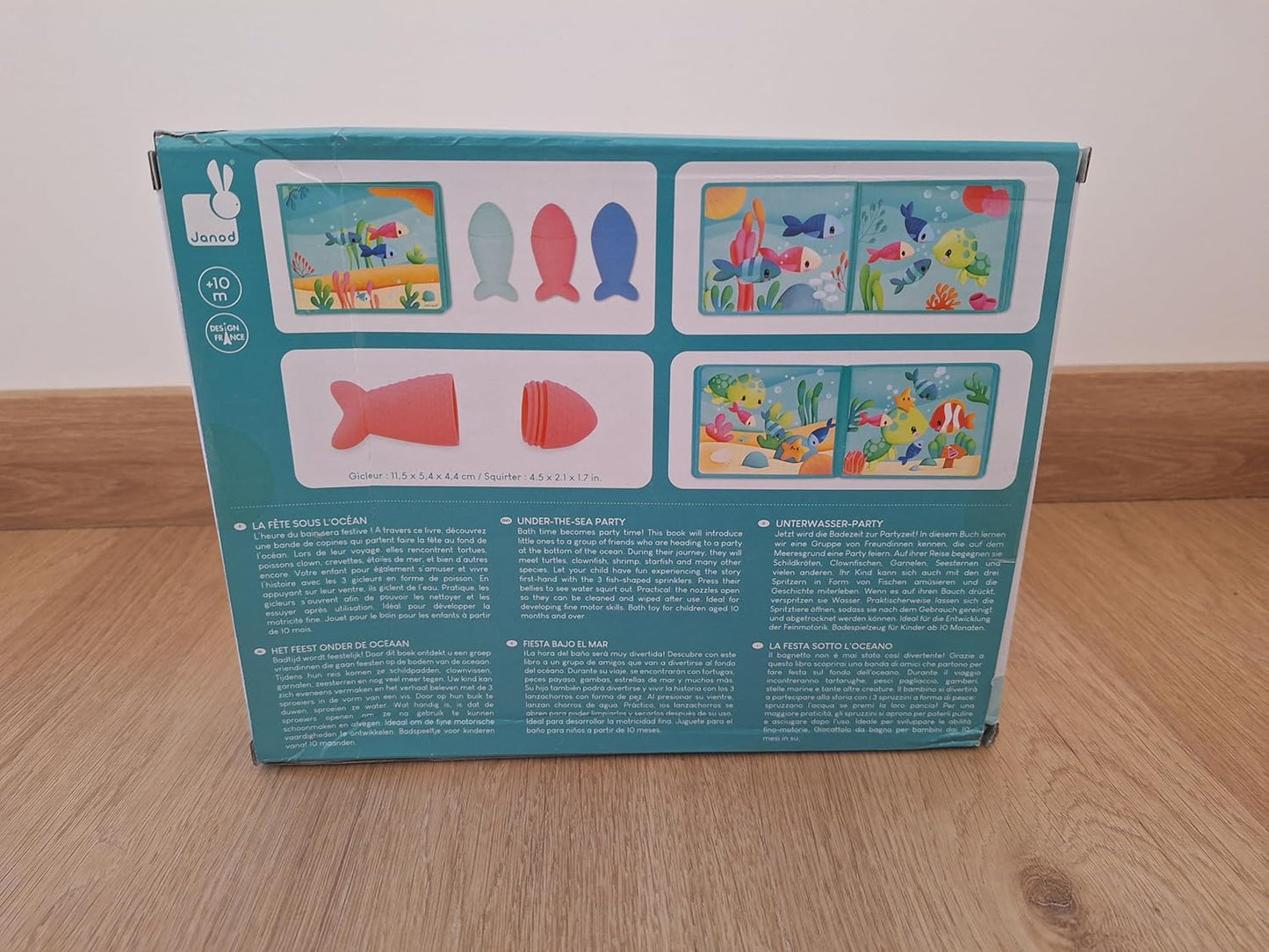 Janod - Livro de banho interativo com 3 brinquedos de aspersão incluídos - 1 livro + 3 aspersores - Desenvolve habilidades motoras finas - Fácil de limpar - A partir de 10 meses - J04733