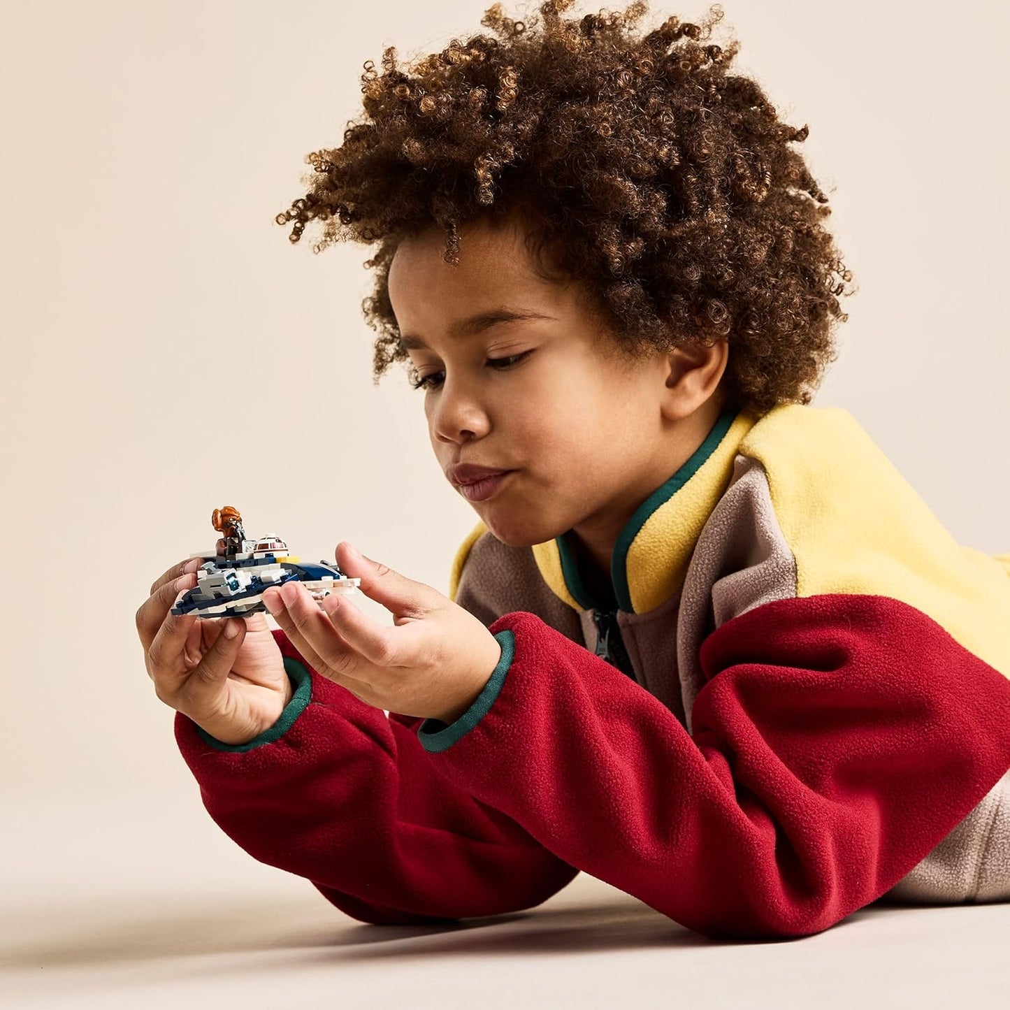 LEGO Star Wars: The Clone Wars Jedi Starfighter Microfighter de Plo Koon, brinquedo de construção colecionável para crianças, presente para meninos, meninas e fãs com 6 anos ou mais, inclui um sabre de luz azul 75400