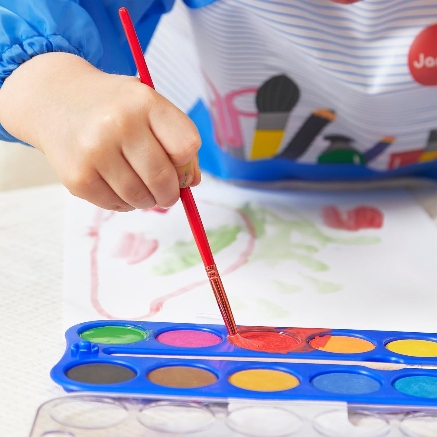 Janod - Pincéis - 4 tamanhos diferentes - Pincéis, Janod - Tintas para dedos para bebês a partir de 1 ano, Janod - Paleta de tinta à base de água - 12 almofadas e pincel, Janod - Avental de pintura infantil a partir de 18 meses