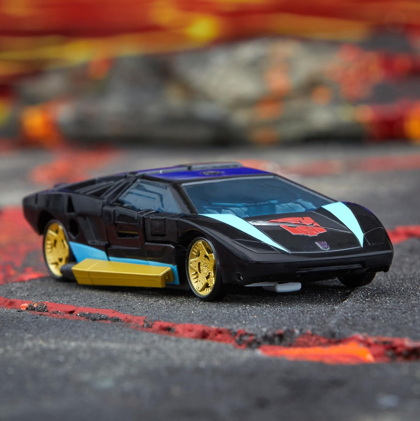 Figura de ação Wheeljack da classe Deluxe de Transformers Legacy do universo Armada