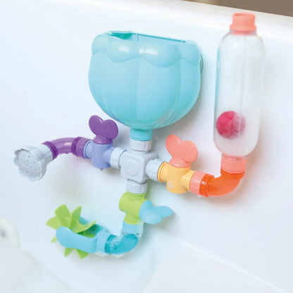 Nuby Copos Wacky Water Works para fixar o brinquedo com segurança na banheira.