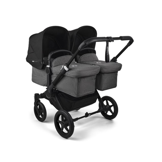 Bugaboo Carrinho Donkey 5 Twin – Capota Midnight Black, tecidos Grey Melange e estrutura preta, design lado a lado.