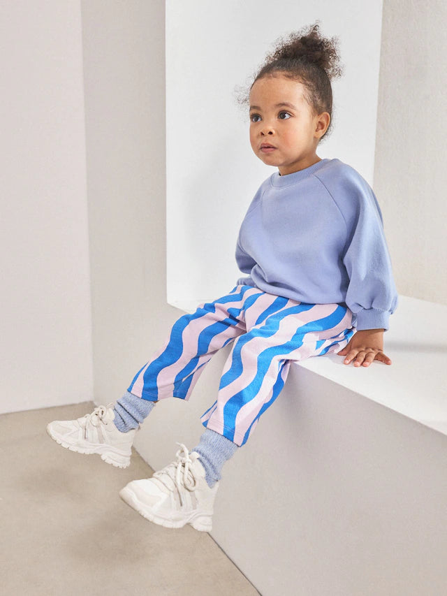 |Girl| Calça Cano Alto Texturizada Com Listras Onduladas Azul/Lilás (3 meses a 7 anos)