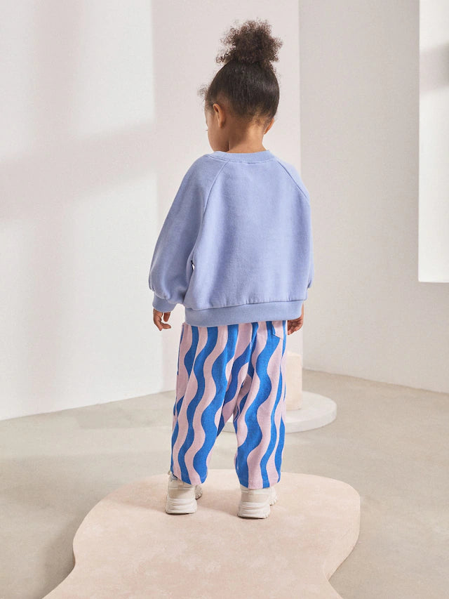 |Girl| Calça Cano Alto Texturizada Com Listras Onduladas Azul/Lilás (3 meses a 7 anos)