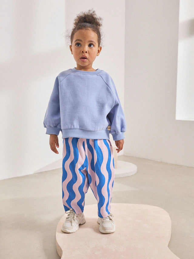 |Girl| Calça Cano Alto Texturizada Com Listras Onduladas Azul/Lilás (3 meses a 7 anos)