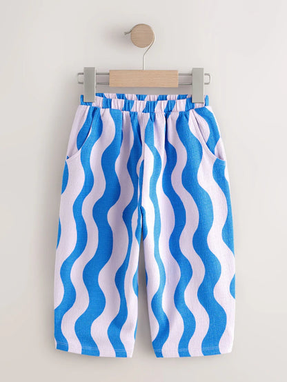 |Girl| Calça Cano Alto Texturizada Com Listras Onduladas Azul/Lilás (3 meses a 7 anos)