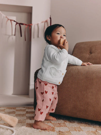 |BabyGirl| Casaquinho Infantil Branco Com Bolso Em Formato De Coração e Fechamento Frontal por botões (0 meses a 2 anos)
