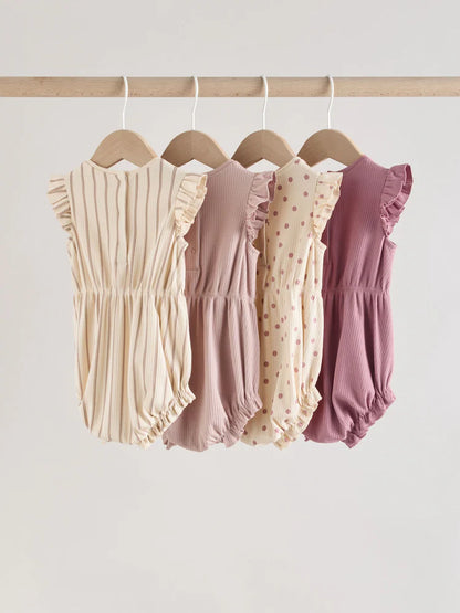 |BabyGirl| Conjunto Com 4 Macacões De Bebê Rosa com Estampa De Bolinhas e Listras Em Tons de rosa e babados nos ombros.