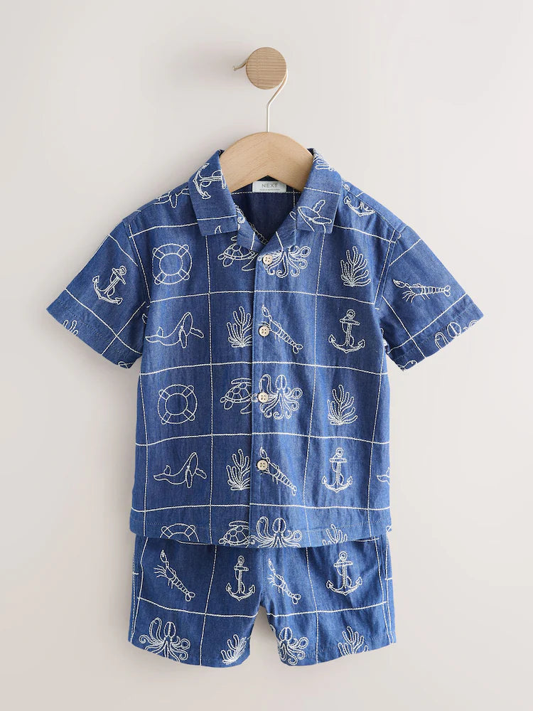|Boy| Conjunto De Camisa e Shorts De Manga Curta Com Gola Redonda e Bordado De Vida Marinha em jeans azul.
