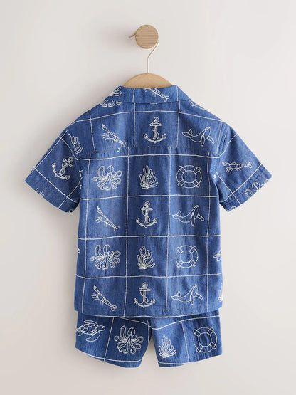 |Boy| Conjunto De Camisa e Shorts De Manga Curta Com Gola Redonda e Bordado De Vida Marinha em jeans azul.