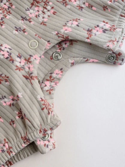 |BabyGirl| Conjunto De 4 Macacões De Bebê Em Malha Jersey Com Estampa Floral Neutra.