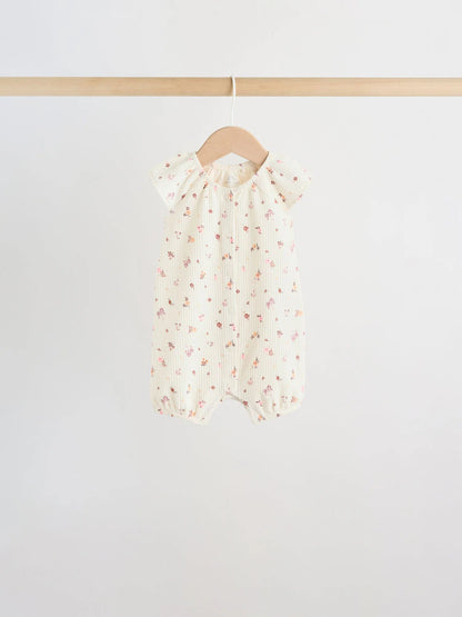 |BabyGirl| Conjunto De 4 Macacões De Bebê Em Malha Jersey Com Estampa Floral Neutra.