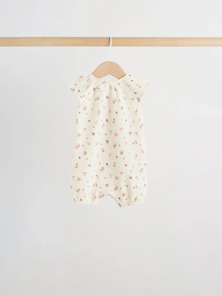 |BabyGirl| Conjunto De 4 Macacões De Bebê Em Malha Jersey Com Estampa Floral Neutra.