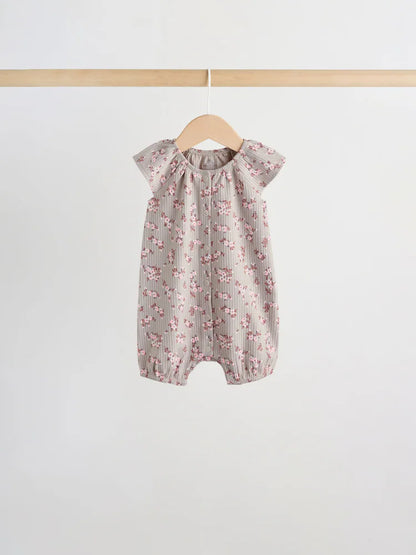 |BabyGirl| Conjunto De 4 Macacões De Bebê Em Malha Jersey Com Estampa Floral Neutra.