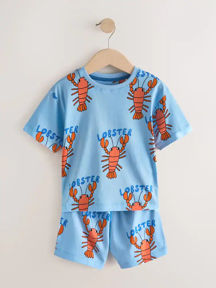 |Boy| Conjunto De 3 Pijamas Curtos Com Estampas Variadas De Dinossauro, Escavadeira e Lagosta nas cores azul, verde e vermelho (tamanhos de 9 meses a 8 anos)
