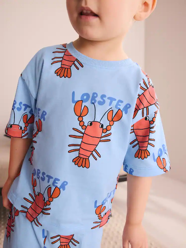 |Boy| Conjunto De 3 Pijamas Curtos Com Estampas Variadas De Dinossauro, Escavadeira e Lagosta nas cores azul, verde e vermelho (tamanhos de 9 meses a 8 anos)