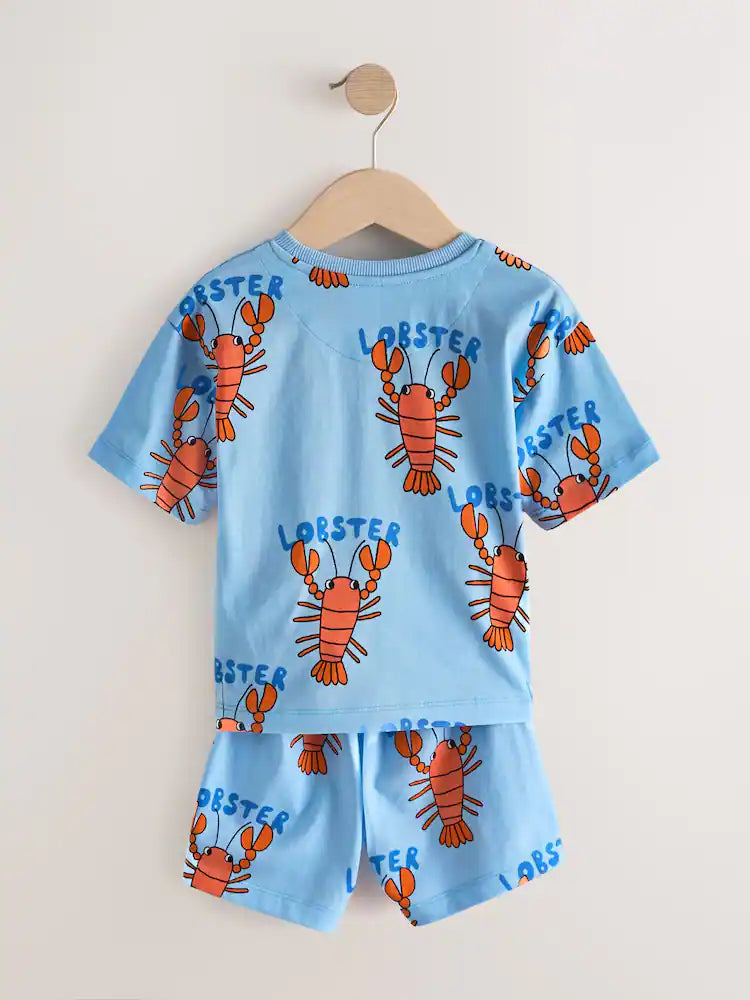 |Boy| Conjunto De 3 Pijamas Curtos Com Estampas Variadas De Dinossauro, Escavadeira e Lagosta nas cores azul, verde e vermelho (tamanhos de 9 meses a 8 anos)
