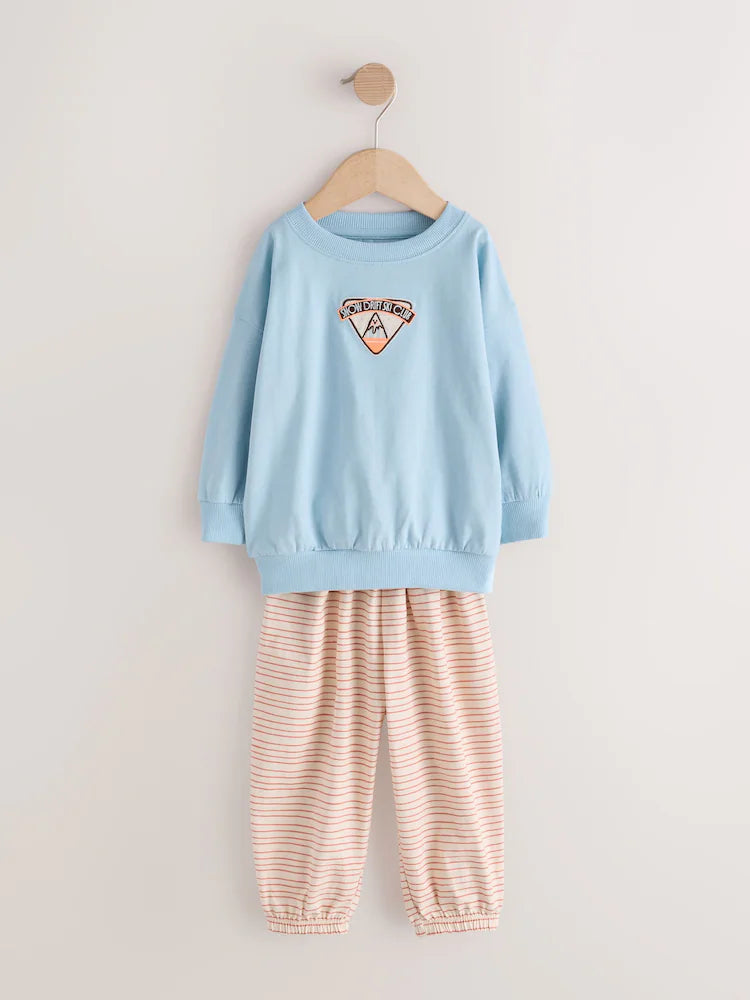 |Girl| Kit Com 3 Pijamas Estilo Jogger Com Estampa De Esqui Em Tons Neutros (9 meses a 12 anos)