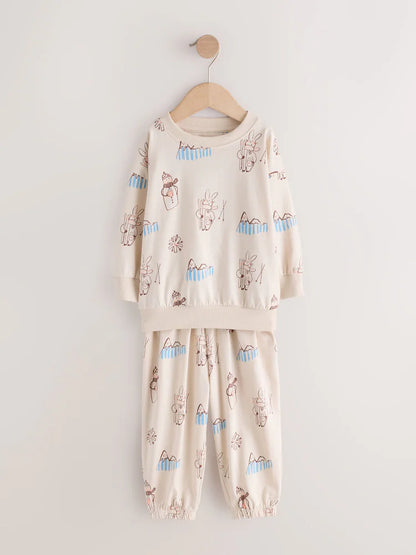 |Girl| Kit Com 3 Pijamas Estilo Jogger Com Estampa De Esqui Em Tons Neutros (9 meses a 12 anos)
