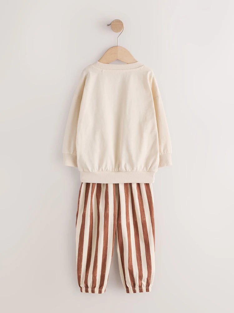|Girl| Kit Com 3 Pijamas Estilo Jogger Com Estampa De Esqui Em Tons Neutros (9 meses a 12 anos)