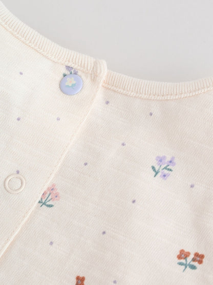 |BabyGirl| Conjunto Com 3 Macacões Florais Lilás e Cru Com Babados Nos Ombros