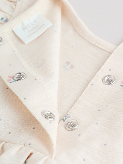 |BabyGirl| Conjunto Com 3 Macacões Florais Lilás e Cru Com Babados Nos Ombros