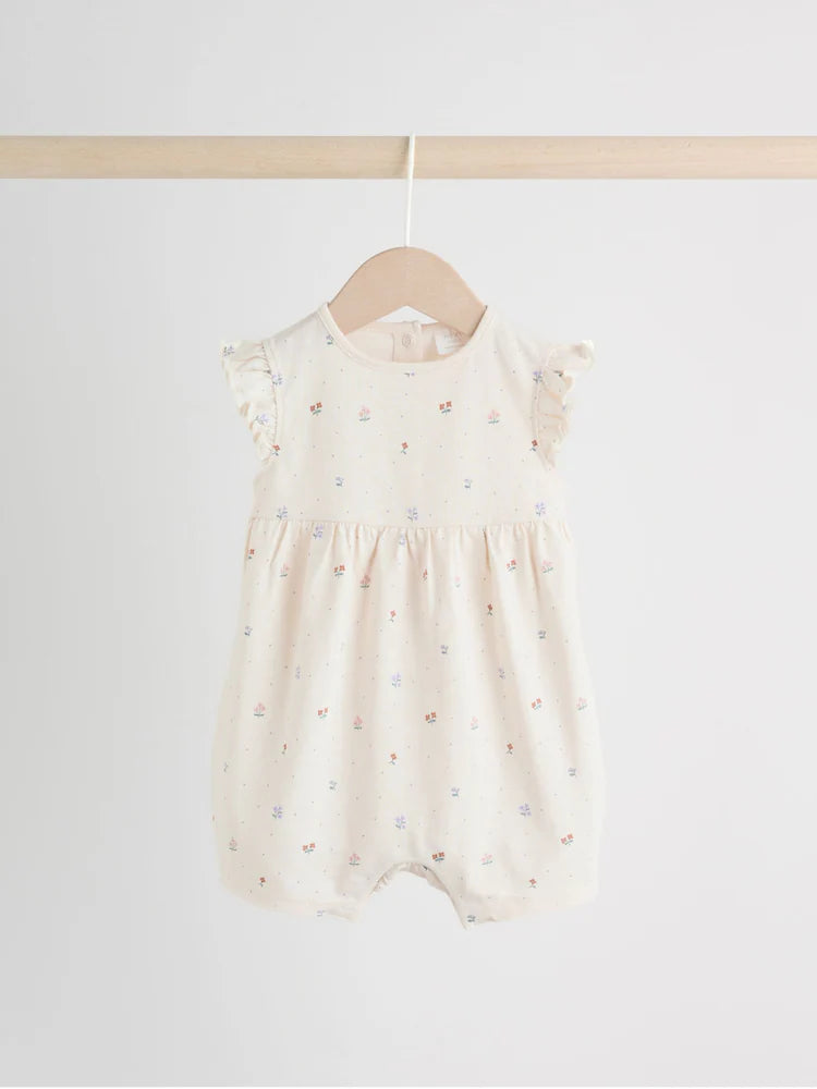 |BabyGirl| Conjunto Com 3 Macacões Florais Lilás e Cru Com Babados Nos Ombros