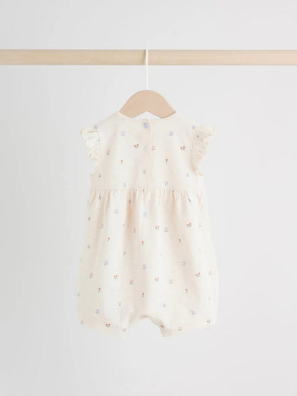 |BabyGirl| Conjunto Com 3 Macacões Florais Lilás e Cru Com Babados Nos Ombros