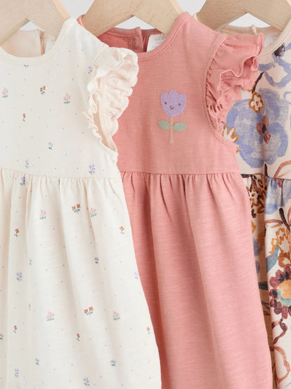 |BabyGirl| Conjunto Com 3 Macacões Florais Lilás e Cru Com Babados Nos Ombros