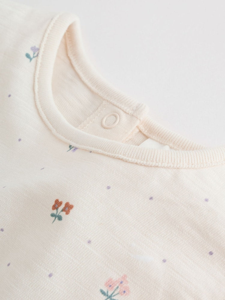 |BabyGirl| Conjunto Com 3 Macacões Florais Lilás e Cru Com Babados Nos Ombros