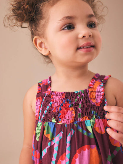 |Girl| Macacão Curto Estampado Em Tons De Roxo e Vermelho (3 meses a 7 anos)